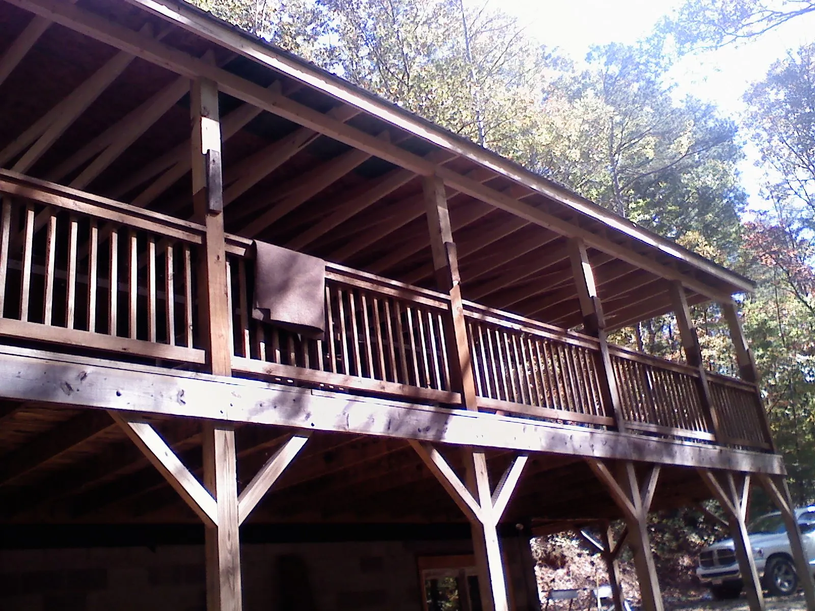 Timber framing under a new elevated porch and deck — Roof Leak Repair in Rochelle by Roofing Brothers